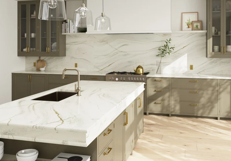 Kitchen with sage green cabinets and Calacatta gold quartz